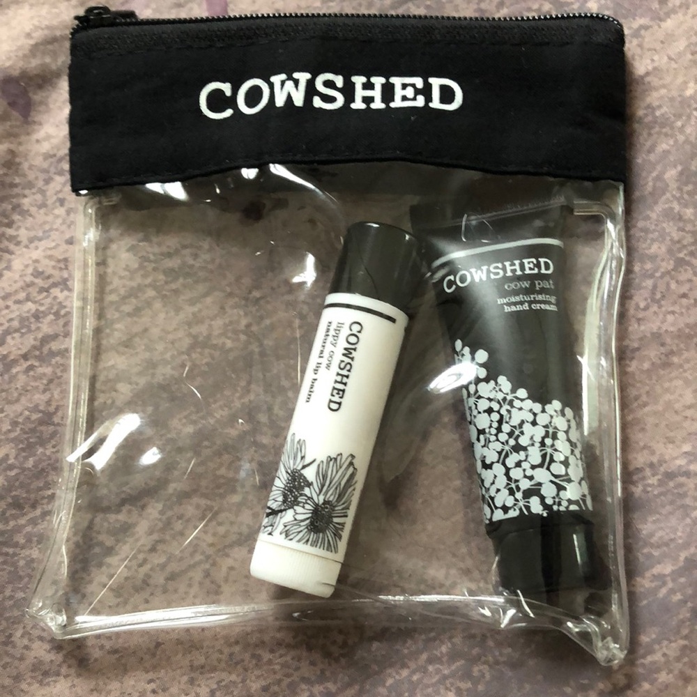 Cowshed travel size hand cream and lip balm. In small plastic zipper pouch case.